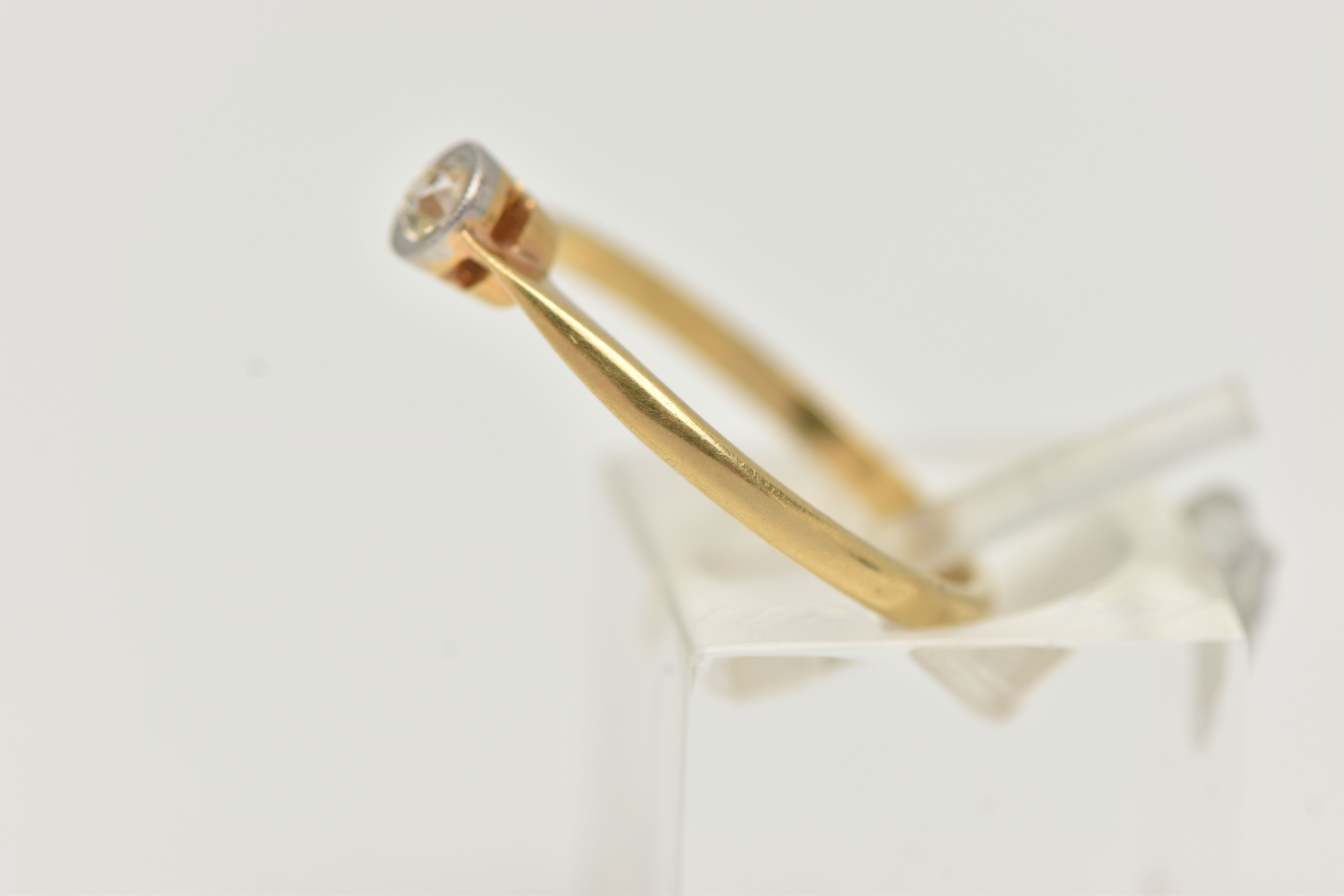 A DIAMOND SINGLE STONE RING, an old cut diamond collet set with milgrain detail, leading on to a - Image 2 of 4