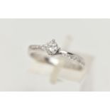 A MODERN 18CT WHITE GOLD DIAMOND RING, a round brilliant cut diamond with faceted girdle,