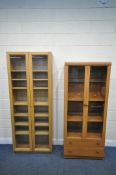 A TALL IKEA BILLY BOOKCASE, with double glazed doors, enclosing seven adjustable shelves, width 81cm