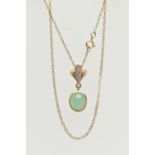 A YELLOW METAL GEMSET NECKLACE, an oval cabochon jade stone, collet set in yellow metal, leading