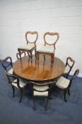 A LARGE REPRODUCTION VICTORIAN STYLE MAHOGANY CIRCULAR DINING TABLE, on cabriole legs, with ball and