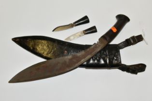 A NEPALESE GURKHA KUKRI KNIFE, in its leather scabbard complete with its Kardar and Chakma knives