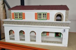 A KIT BUILT HACIENDA STYLE DOLL'S HOUSE, cantilever opening, two storey, unfurnished, no