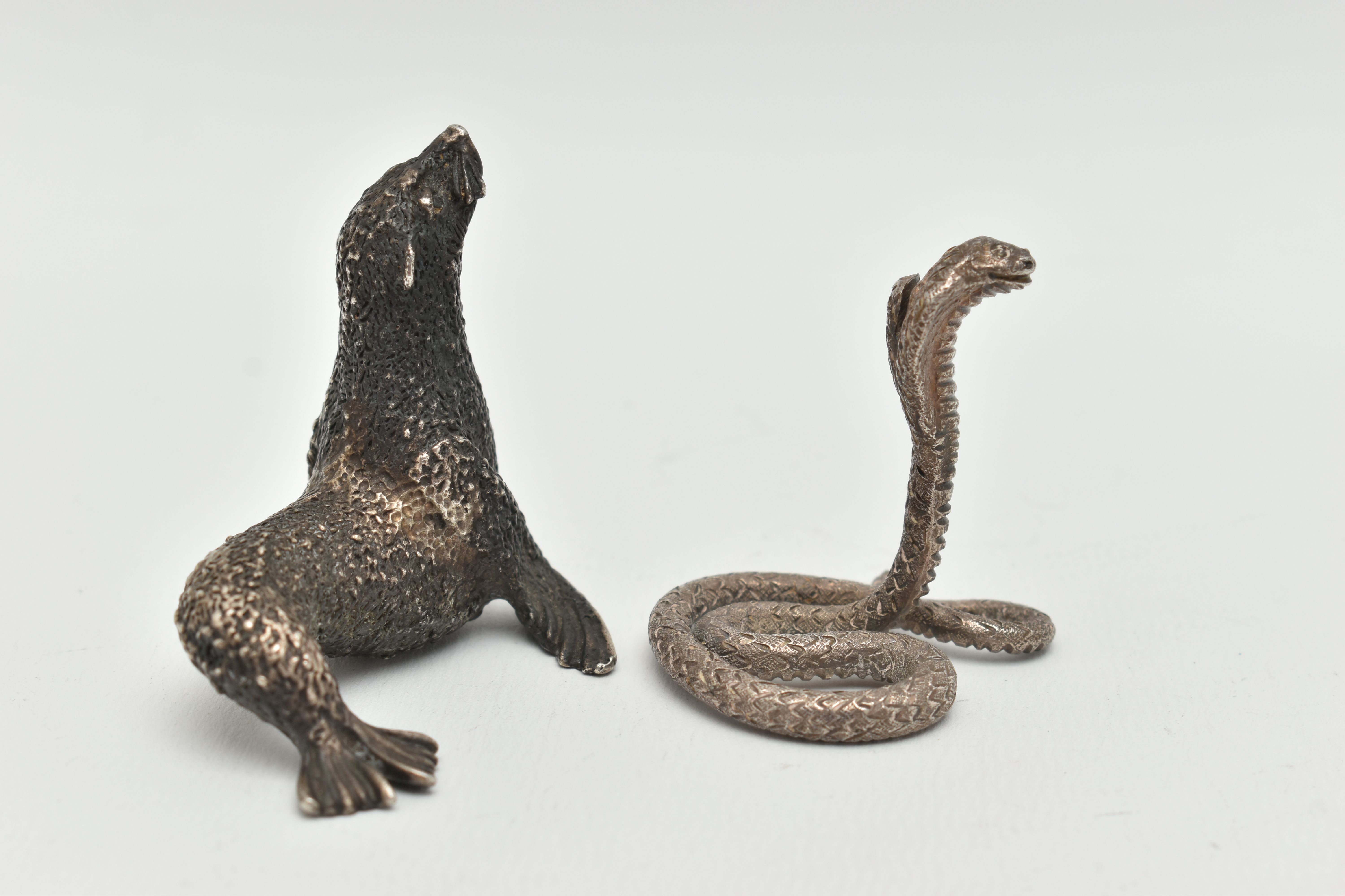 TWO WHITE METAL FIGURINES, the first a textured white metal seal, approximate height 55mm, stamps - Image 2 of 4