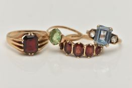 FOUR GEM SET RINGS, the first a five stone oval cut garnet ring, prong set in yellow gold,