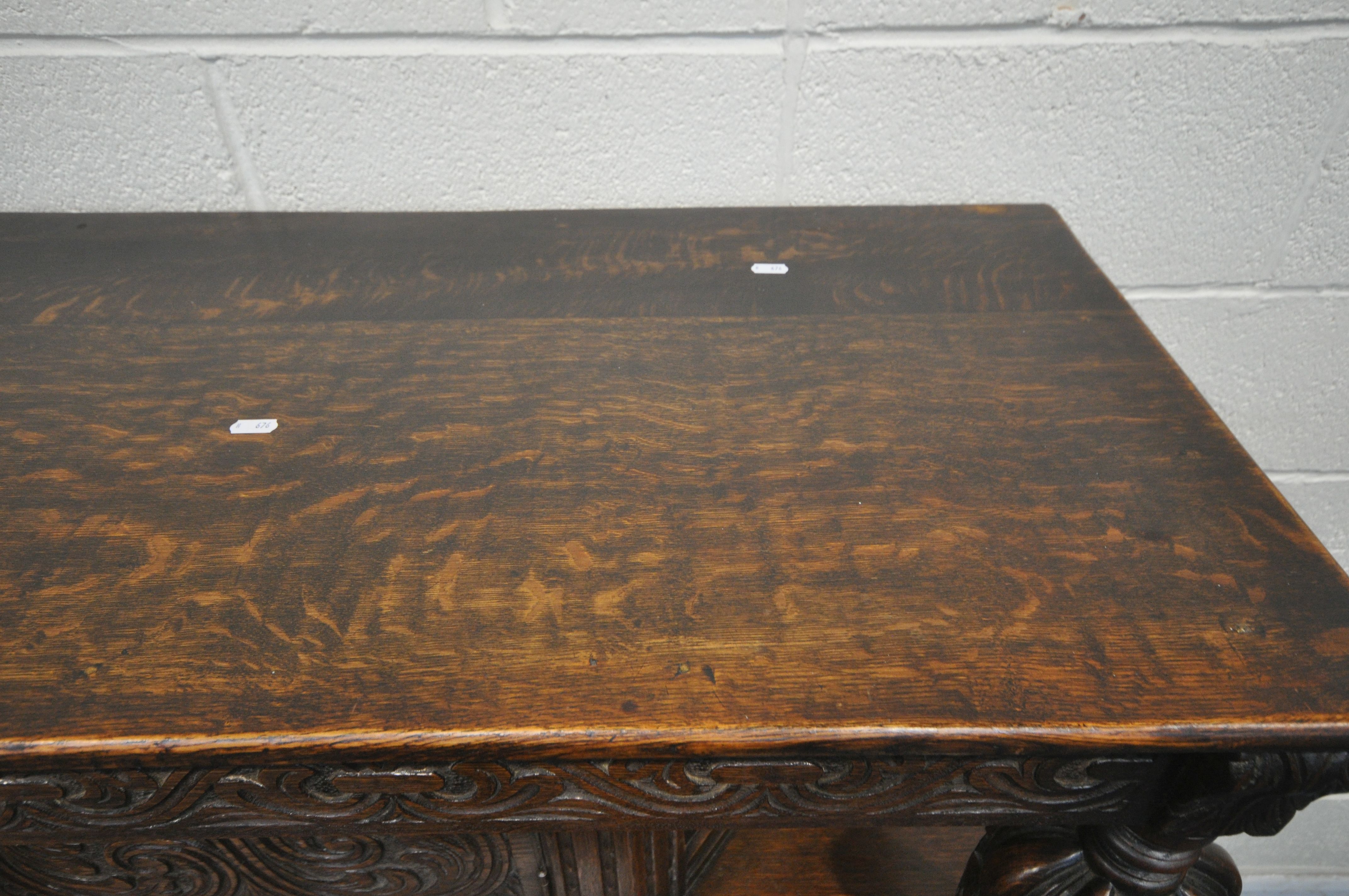 A 20TH CENTURY OAK COURT CUPBOARD, the top with a single cupboard door, scrolled and foliate - Image 3 of 7