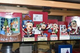 SIX BOXED DISNEY TRADITIONS CHRISTMAS THEMED ORNAMENTS BY JIM SHORE, comprising 'God Bless Us