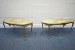 A PAIR OF ONYX AND BRASS OVAL COFFEE TABLES, bases with foliate detail on cabriole legs, length 98cm