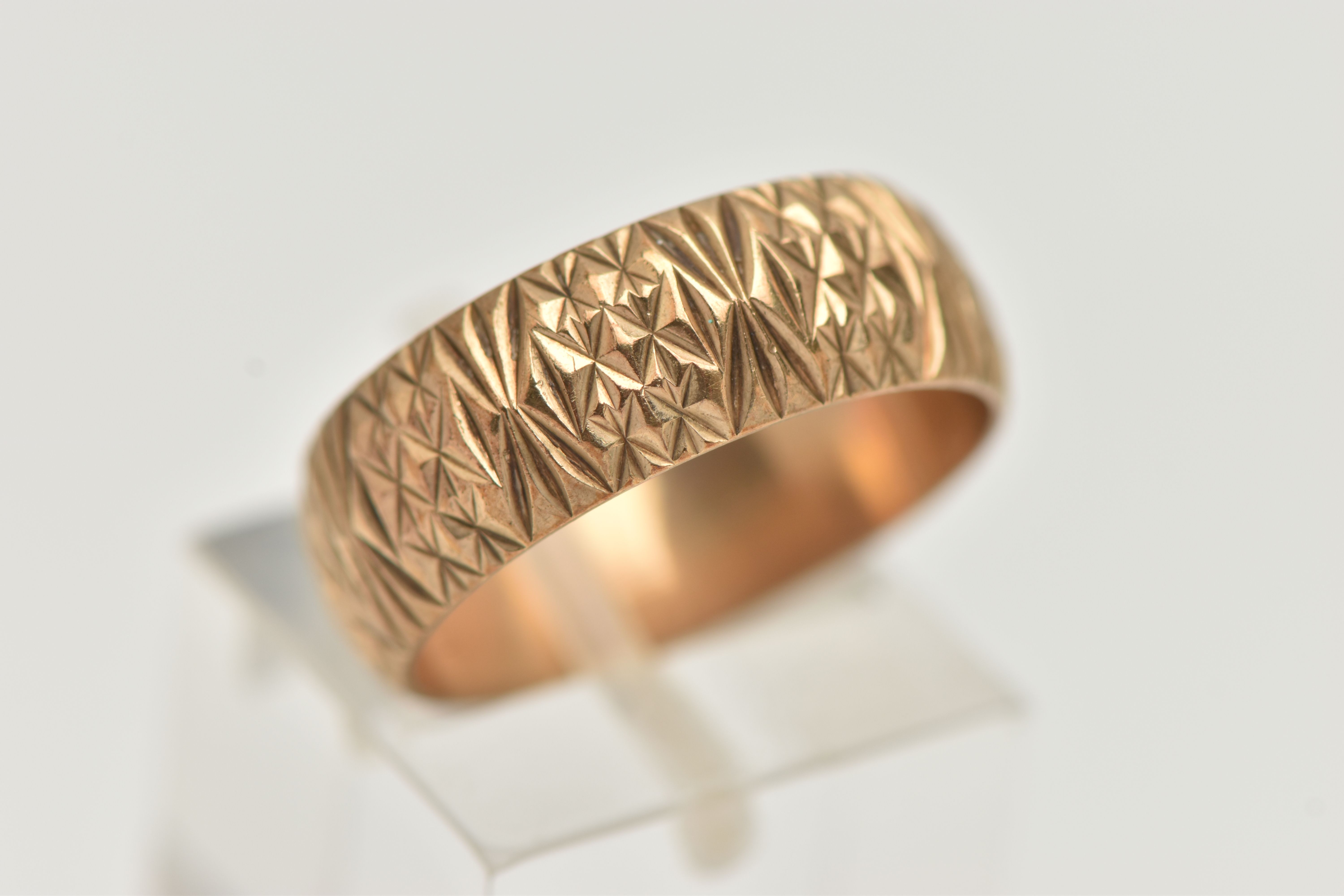 A 9CT YELLOW GOLD RING, designed as a textured band, measuring approximately 7.0mm wide, - Image 4 of 4