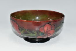 A MOORCROFT POTTERY FLAMBÉ BOWL, the footed bowl in the Anemone pattern on a red/green/blue