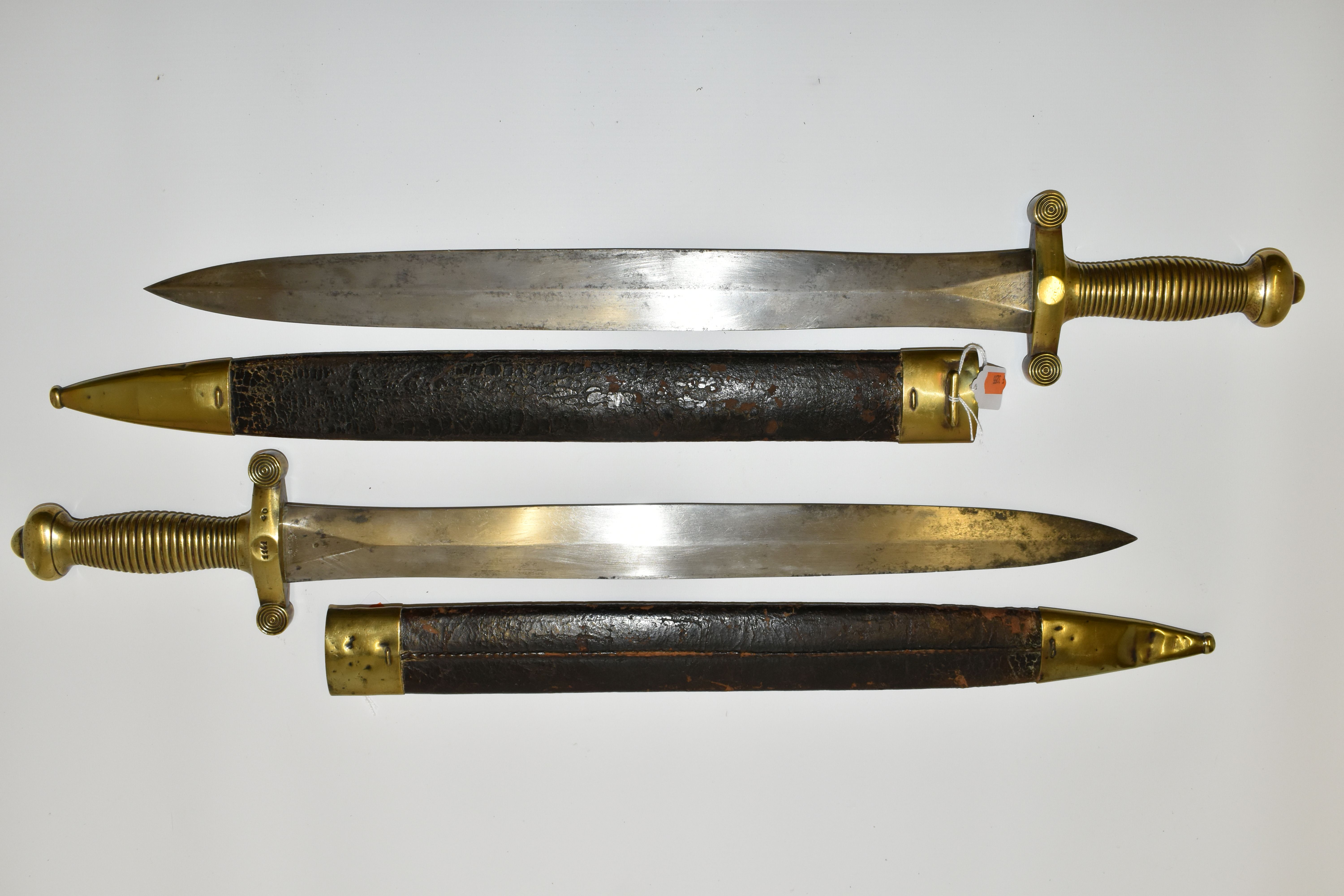 TWO MID 19TH CENTURY FRENCH ARMY CADETS GLADIUS SWORDS, in their original leather covered