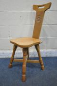 COLIN 'BEAVERMAN' ALMACK, AN ENGLISH OAK COTTAGE CHAIR, cresting rail with pierced handle, the