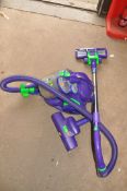 A DYSON DC05 VACUUM CLEANER with two floor heads and two other accessories (PAT pass and working)