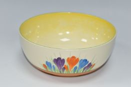 A CLARICE CLIFF 'CROCUS' PATTERN BOWL, the footed bowl painted with orange, purple and blue crocus