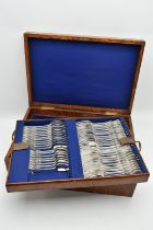 A LATE 19TH CENTURY OAK CASED THREE TIER CANTEEN OF LATE 19TH AND EARLY 20TH SILVER FLATWARE BY