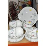 A ROYAL ALBERT 'TRENT ROSE' PATTERN TEA SET, comprising cake plate, milk jug, sugar bowl, six tea