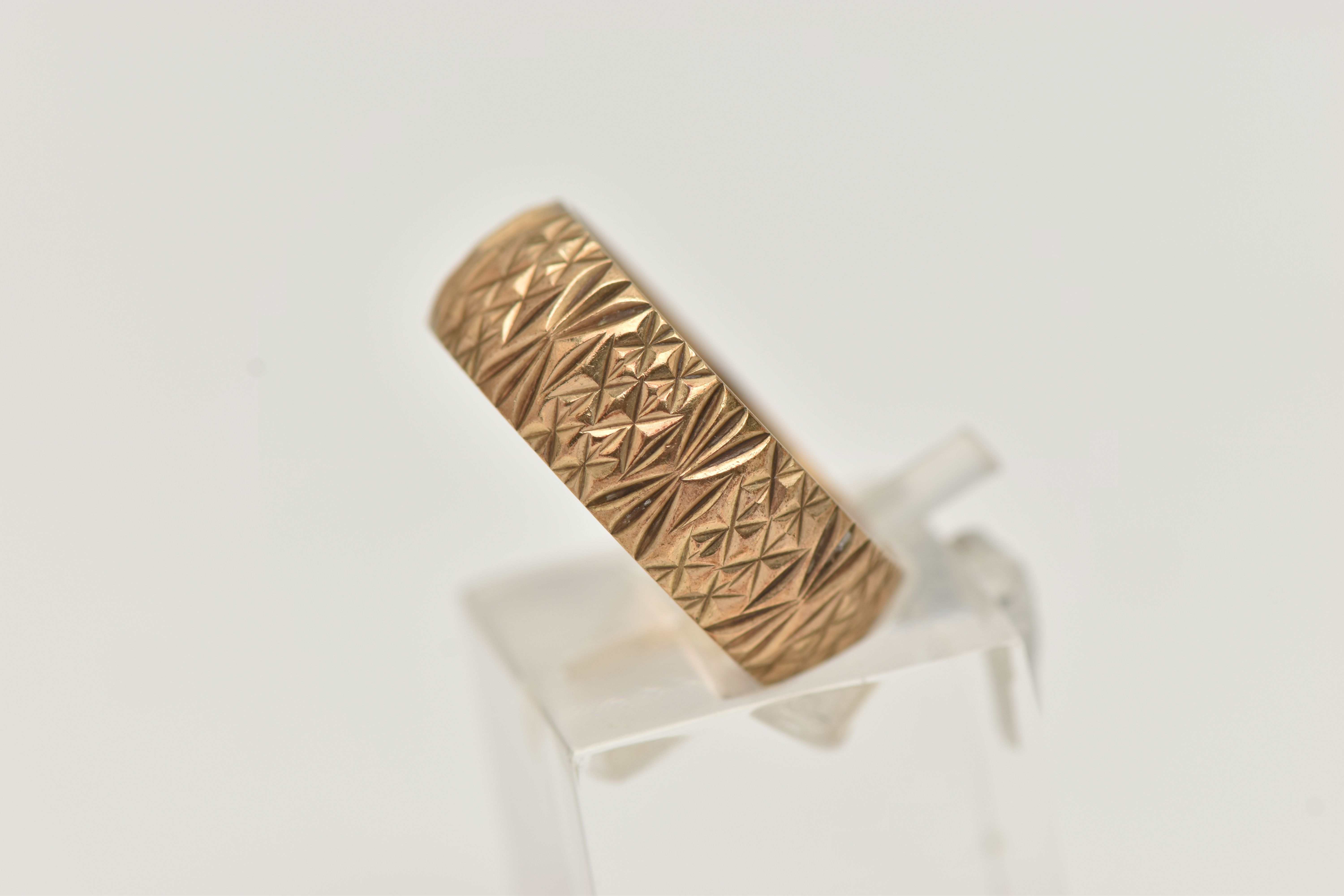 A 9CT YELLOW GOLD RING, designed as a textured band, measuring approximately 7.0mm wide, - Image 2 of 4