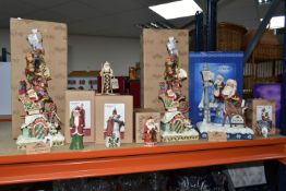 EIGHT BOXED JIM SHORE RESIN CHRISTMAS FIGURES, comprising two 'Heaped with Holiday' sculptures of