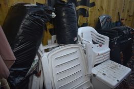 A SELECTION OF PLASTIC GARDEN FURNITURE, to include six Hartman black stacking armchairs, four white