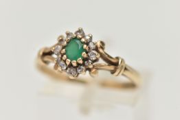 A 9CT GOLD GEMSET RING, an oval cut green chalcedony, set with a surround of circular cut cubic