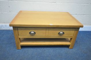 A MODERN OAK EFFECT COFFEE TABLE, with a double sided single drawer, length 96cm x depth 60cm x