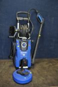 A NILFISK E140.3 PRESSURE WASHER with lance, patio and car brushes (PAT pass and working)