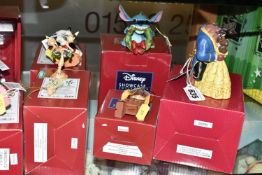 ELEVEN BOXED DISNEY SHOWCASE CHRISTMAS THEMED ORNAMENTS, comprising 'Laughing All The Way' musical