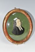 A MOULDED WAX PORTRAIT BUST OF REV. JOHN WESLEY, mounted on green velvet and in an oval gilt
