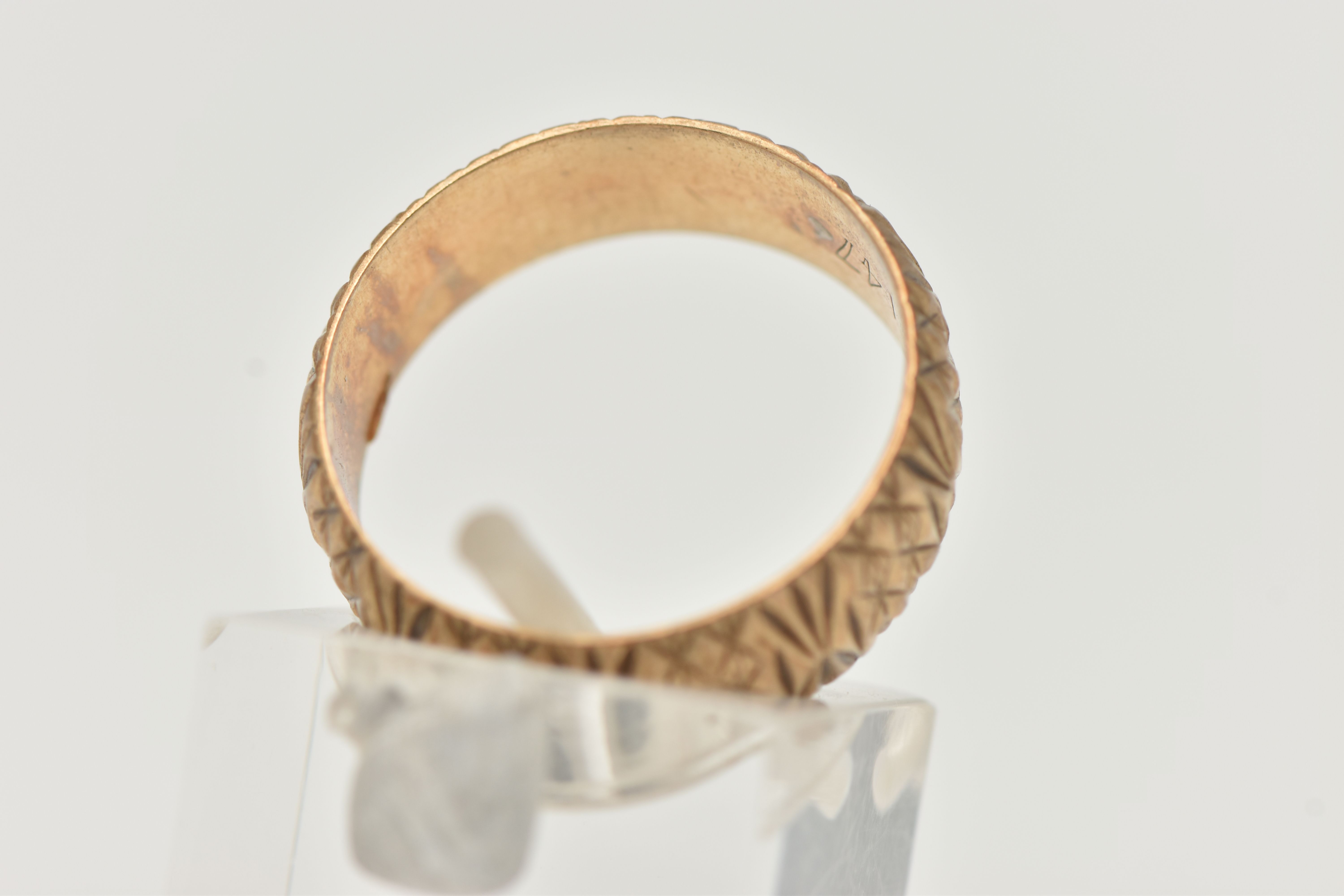 A 9CT YELLOW GOLD RING, designed as a textured band, measuring approximately 7.0mm wide, - Image 3 of 4