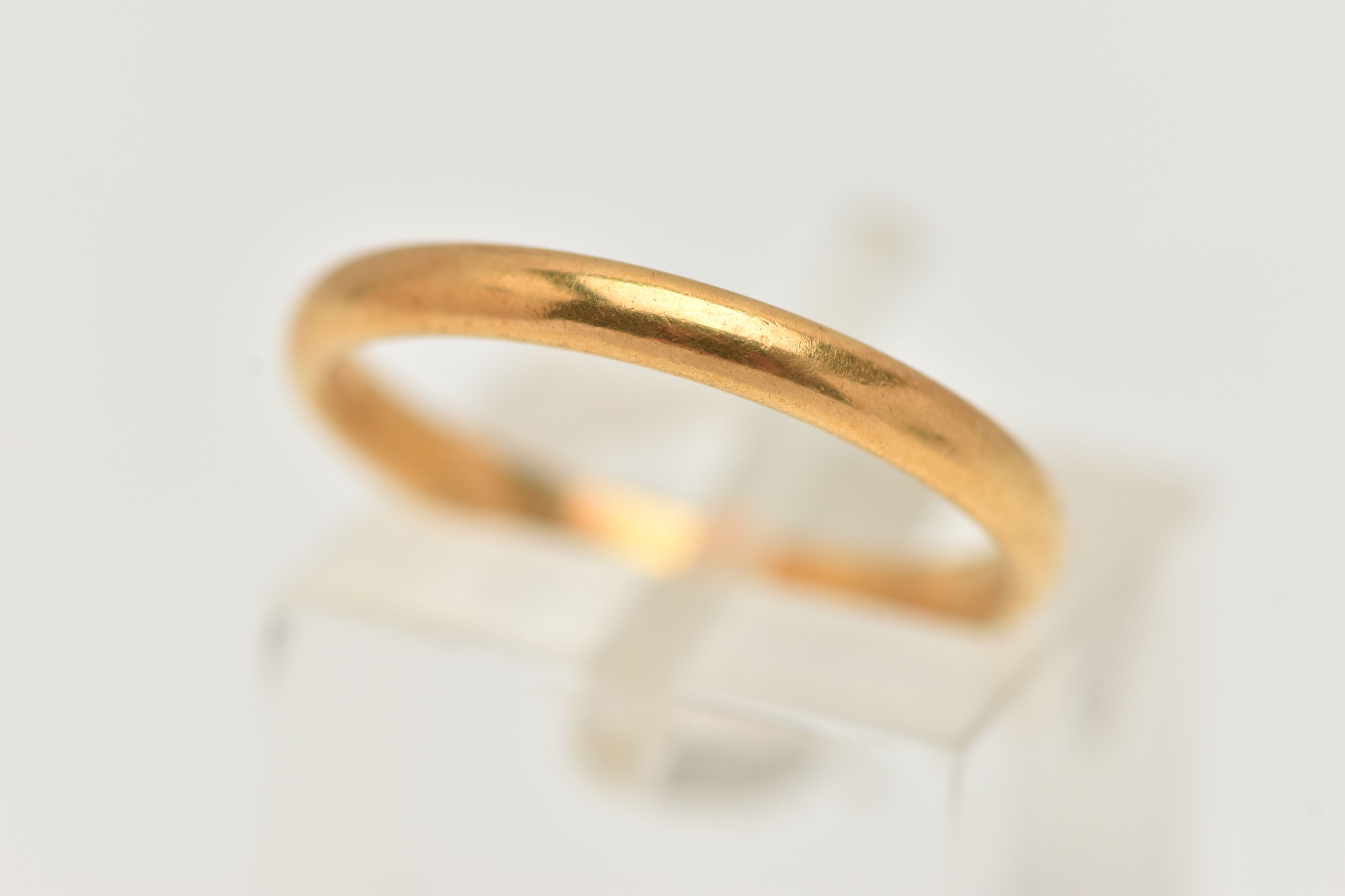 A POLISHED 22CT GOLD BAND RING, hallmarked 22ct Birmingham, ring size M, approximate gross weight
