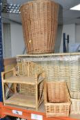 A COLLECTION OF WICKER BASKETS, to include laundry baskets, hamper, a two tier stand, baskets with
