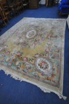 A VERY LARGE CHINESE WOOLLEN RUG, 408cm x 310cm (condition report: stains in various places, sides