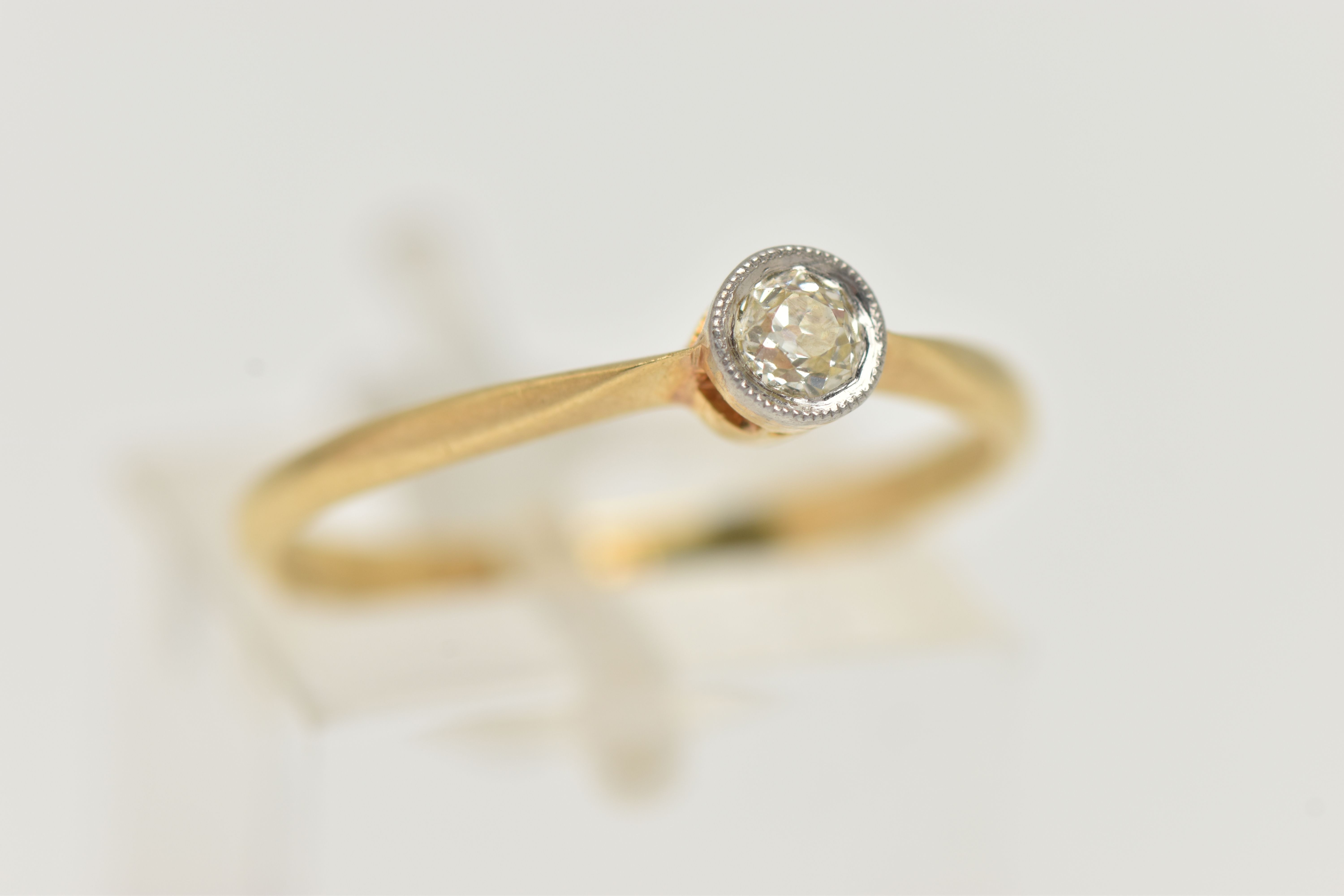 A DIAMOND SINGLE STONE RING, an old cut diamond collet set with milgrain detail, leading on to a - Image 4 of 4