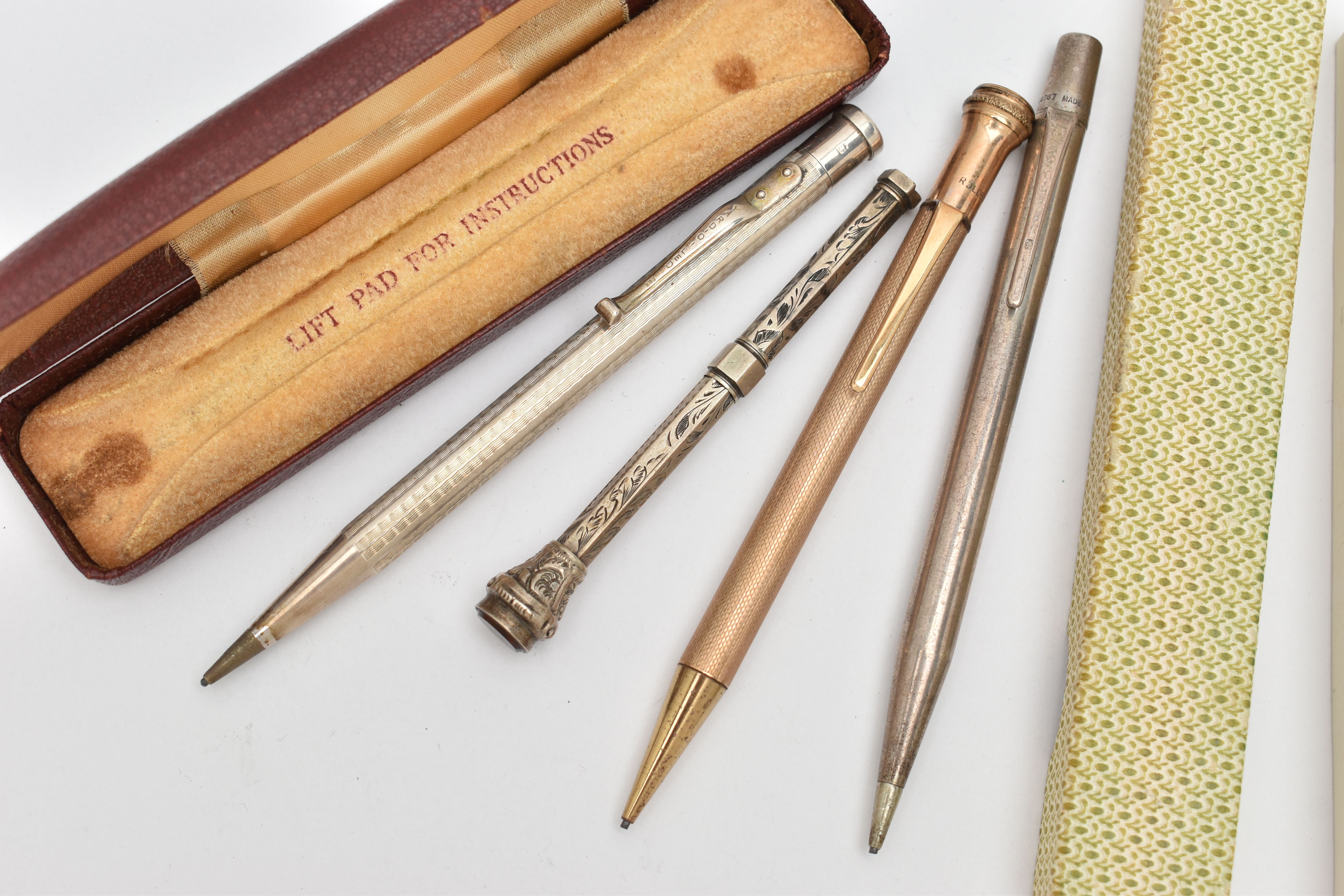FOUR PENCILS, the first a rolled gold propelling pencil, a boxed 'Yard o' Led' silver pencil,