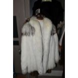 A GROUP OF THREE LADIES FUR COATS, to include a white Arctic fox fur jacket with detailed brown