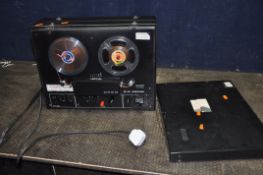 A UHER SG521 VARIOCORD REEL TO REEL RECORDER with smoked plexiglass lid (PAT fail due to uninsulated