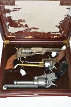 THREE WHITE METAL REPLICA REVOLVERS, designed so they are incapable of conversion to fire live