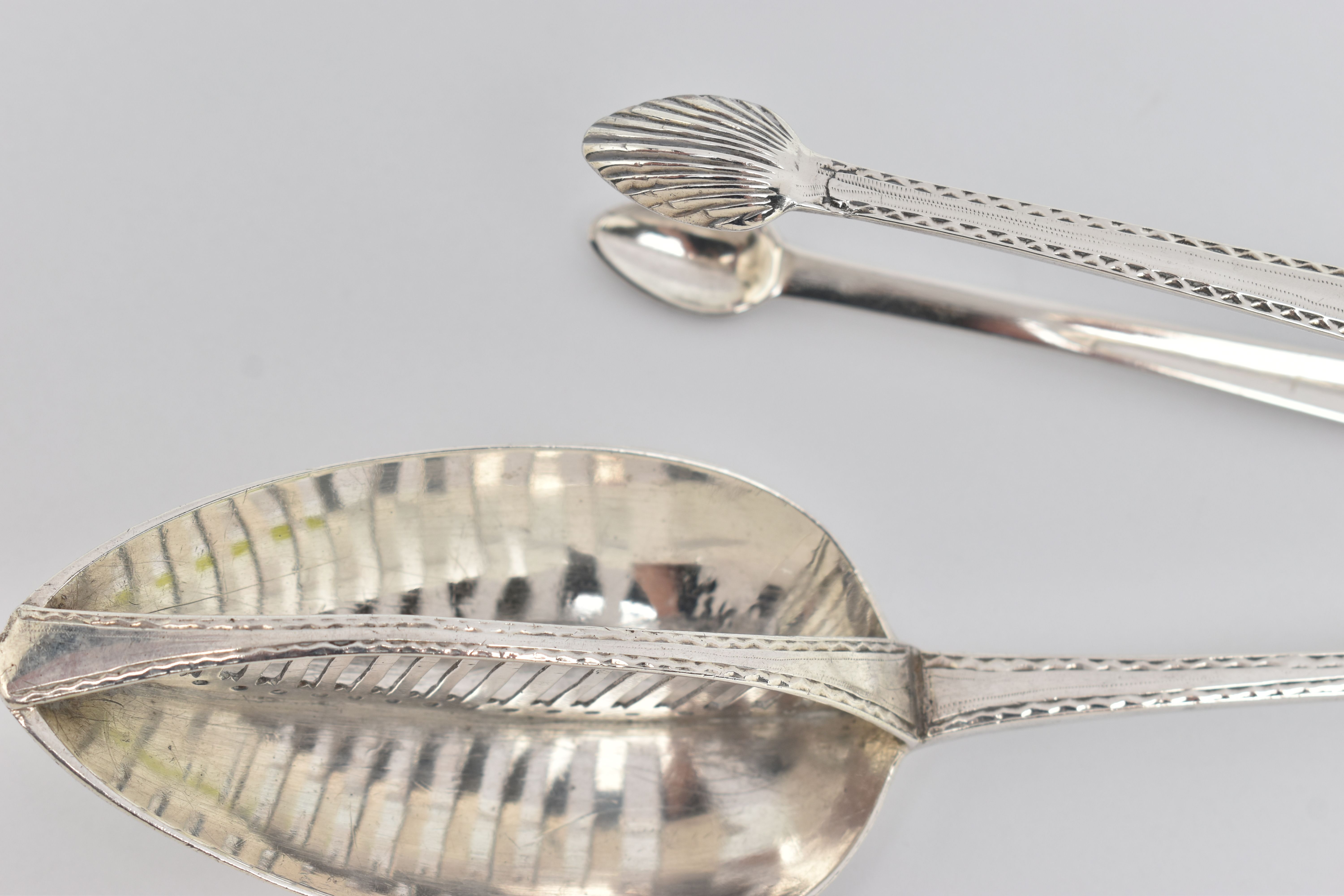 A LATE 18TH CENTURY IRISH SILVER GRAVY STRAINING SPOON AND A PAIR OF SUGAR TONGS WITH MATCHING - Image 4 of 6