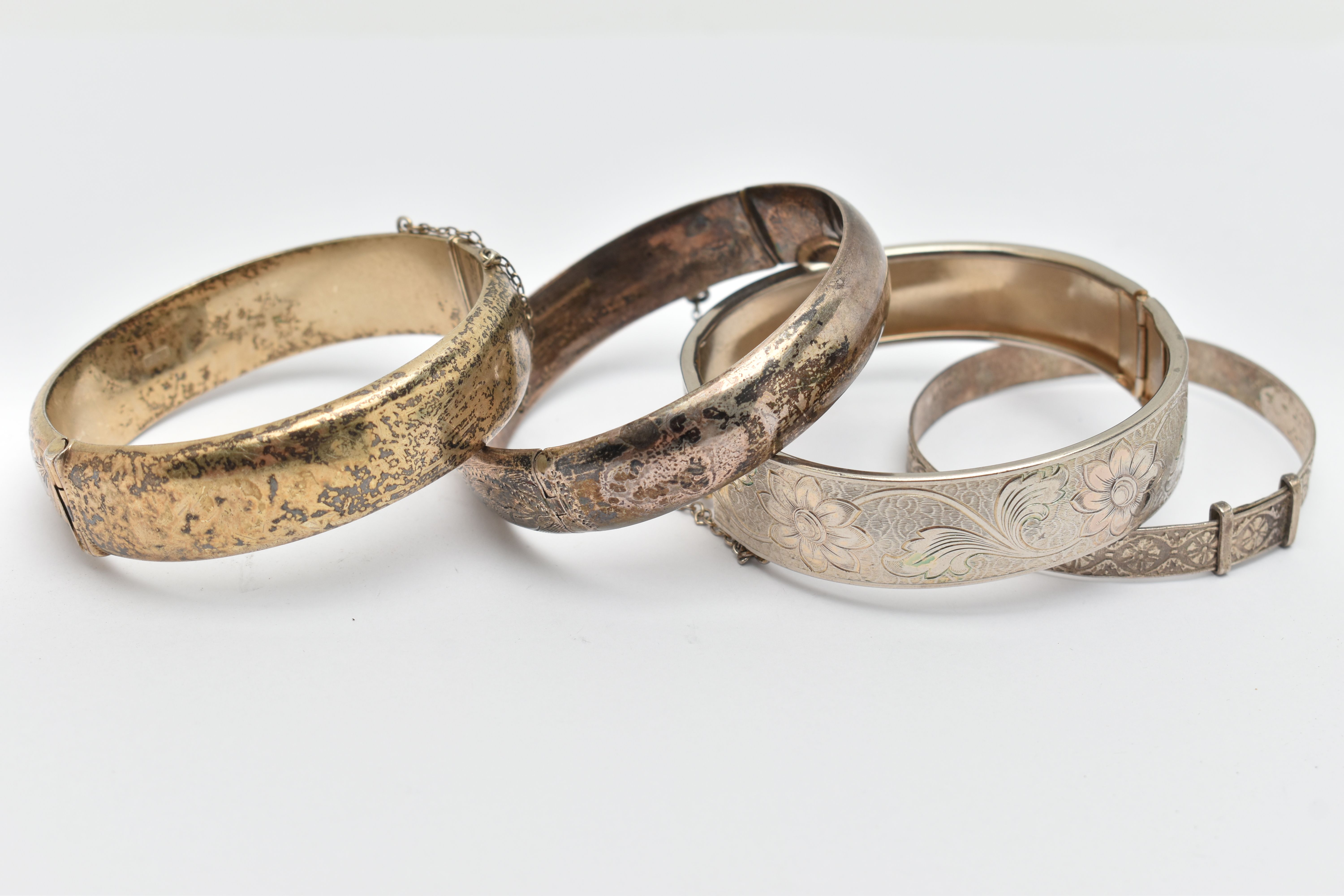 FOUR BANGLES, to include two silver foliage pattern hinged bangles, both fitted with push button - Image 3 of 3