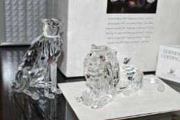 TWO BOXED SWAROVSKI CRYSTAL CHEETAH AND LION FIGURES, comprising Cheetah (variation 2 with higher