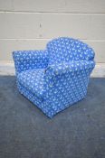 A DUNELM CHILDS BLUE ARMCHAIR, depicting anchors (condition report: in need of a clean)