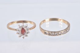 TWO YELLOW METAL GEM SET RINGS, the first an oval cluster set with an oval cut garnet and colourless