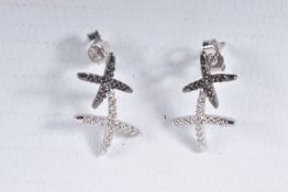 A PAIR OF 9CT GOLD DIAMOND SET EARRINGS, each designed as two crosses set with single cut black