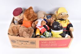 A COLLECTION OF MODERN TEDDY BEARS, majority wearing uniform or motor racing suits, all appear