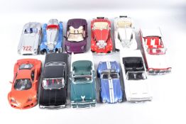 A COLLECTION OF UNBOXED 1/18 SCALE DIECAST AND PLASTIC CAR MODELS, assorted models by Sun Star,