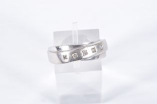 A 9CT WHITE GOLD DIAMOND RING, crossed band design set with a row of five small round brilliant