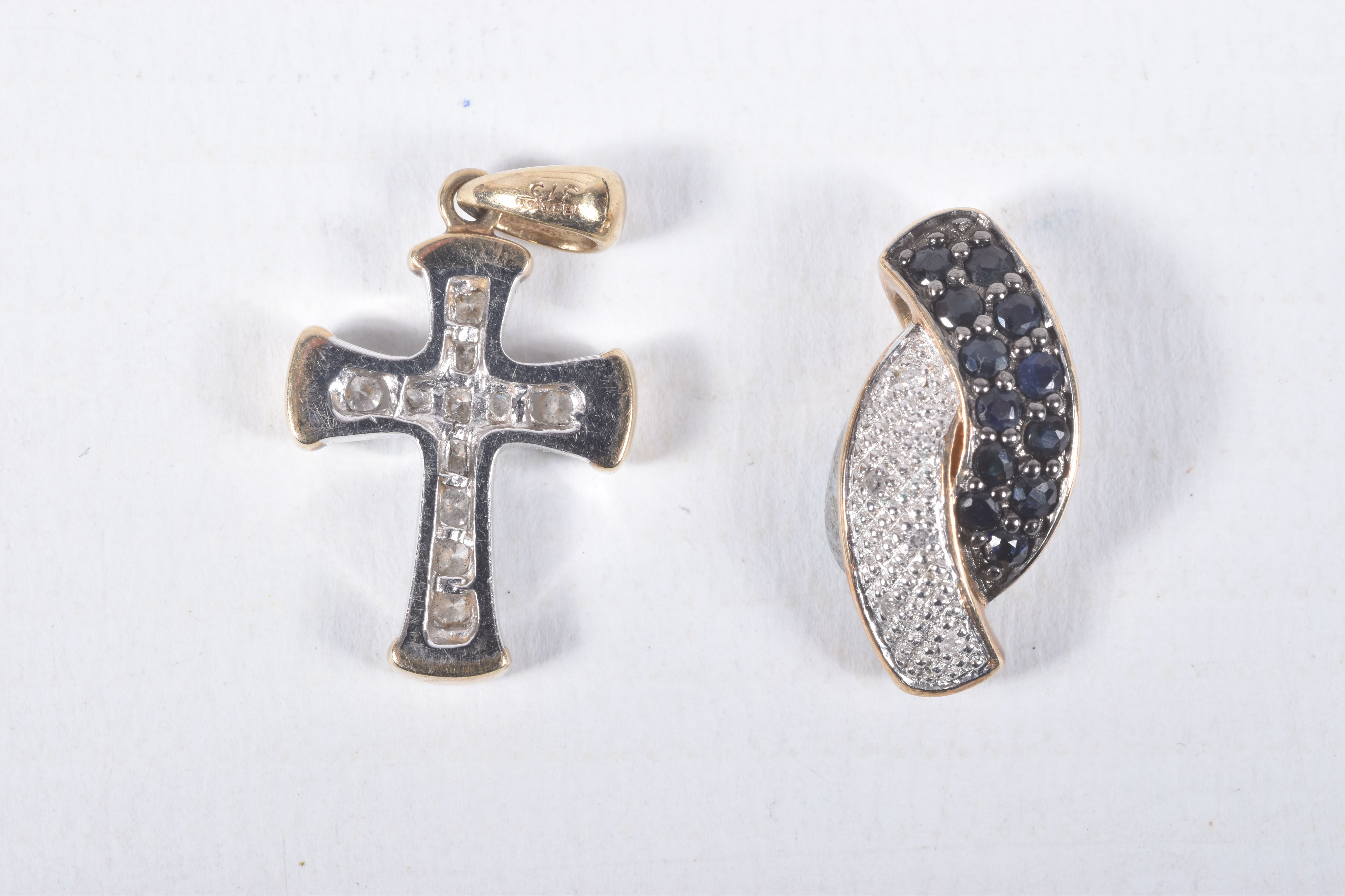 TWO 9CT GOLD GEM SET PENDANTS, the first a bi-colour cross pendant set with colourless diamonds,