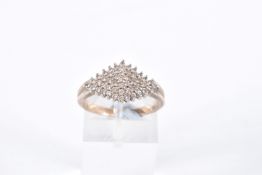 A DIAMOND CLUSTER RING, forty nine single cut diamonds, prong set in white metal, leading on to a