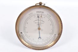 A NEGRETTI & ZAMBRA BRASS CASED CIRCULAR BAROMETER, the silvered dial marked with 'RAIN CHANGE