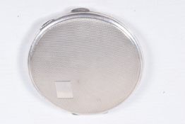 A SILVER COMPACT, circular form, engine turned pattern with vacant cartouche, push button clasp,
